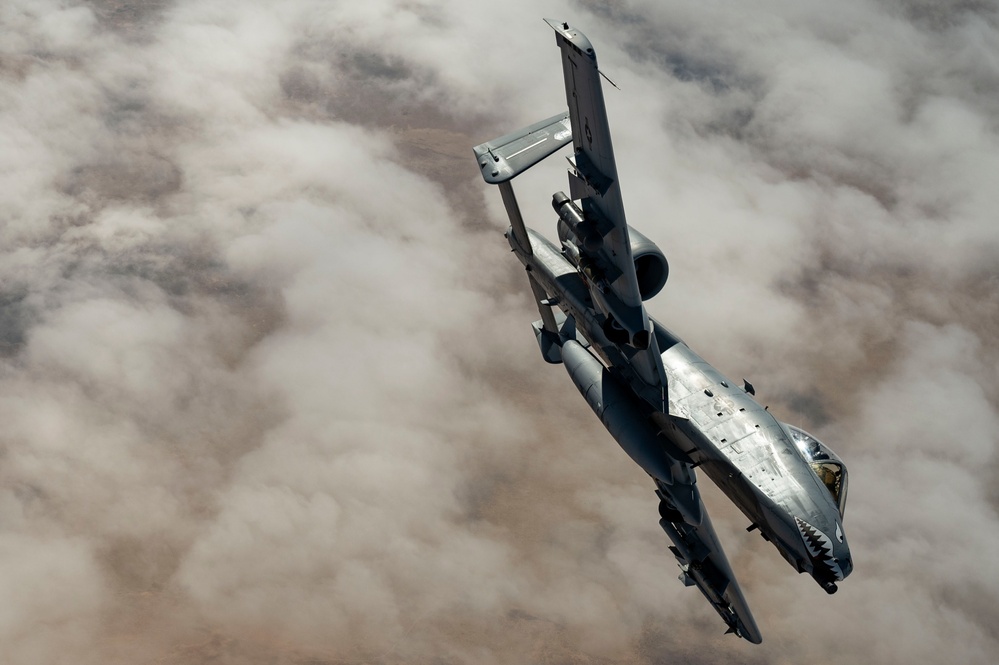 Fighters fly over cloudy skies