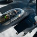 Fighters fly over cloudy skies