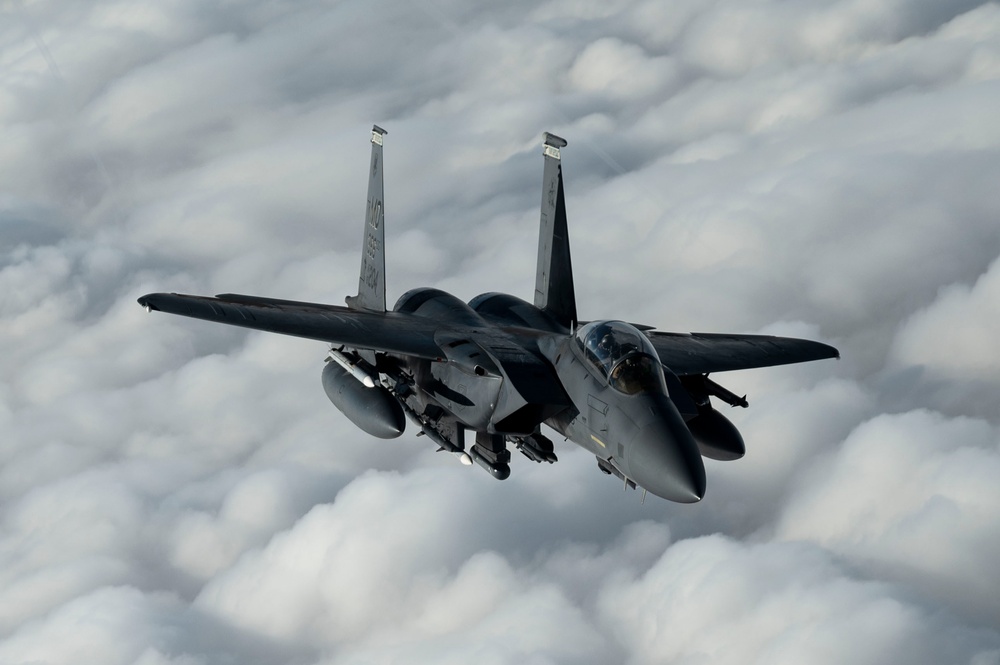 Fighters fly over cloudy skies