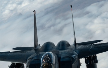 Fighters fly over cloudy skies