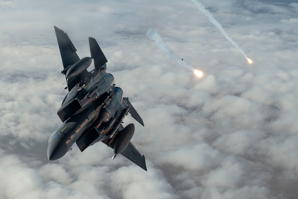 Fighters fly over cloudy skies