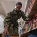 USS Ronald Reagan (CVN 76) Sailors perform retail services