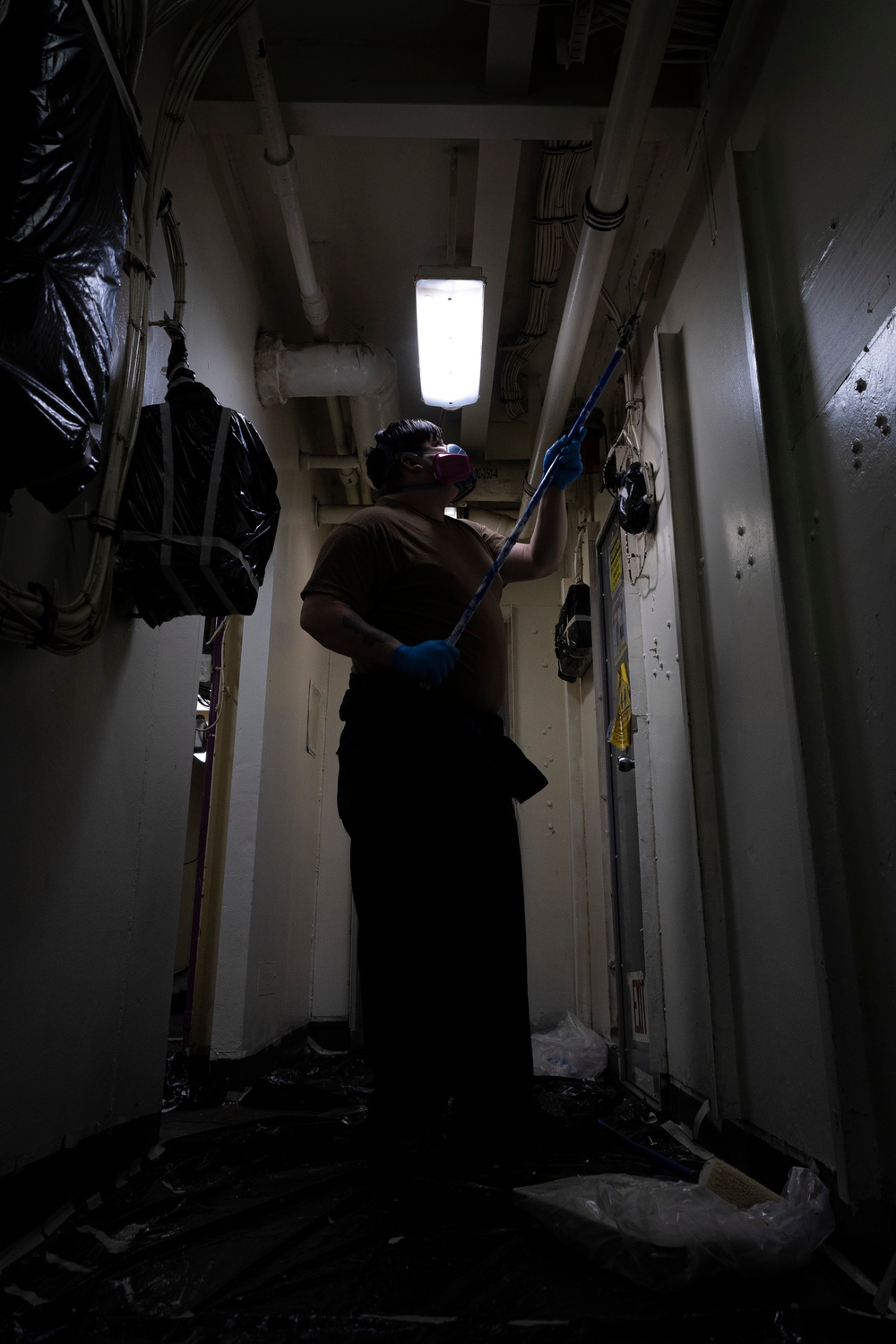 USS Gerald R. Ford (CVN 78) Sailor paints passageway