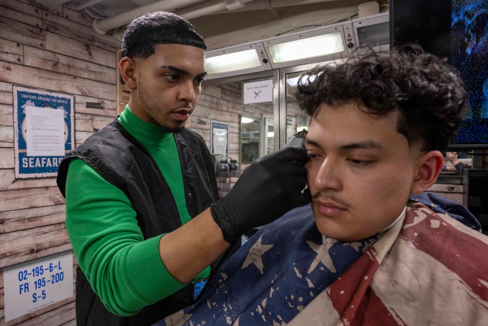 A Nimitz Sailor Cuts Hair in the Barbershop