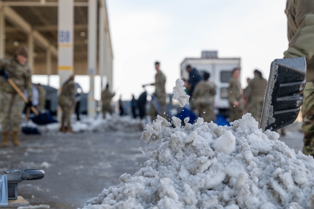 Breaking the Ice: Airmen remove snow, resume flying ops