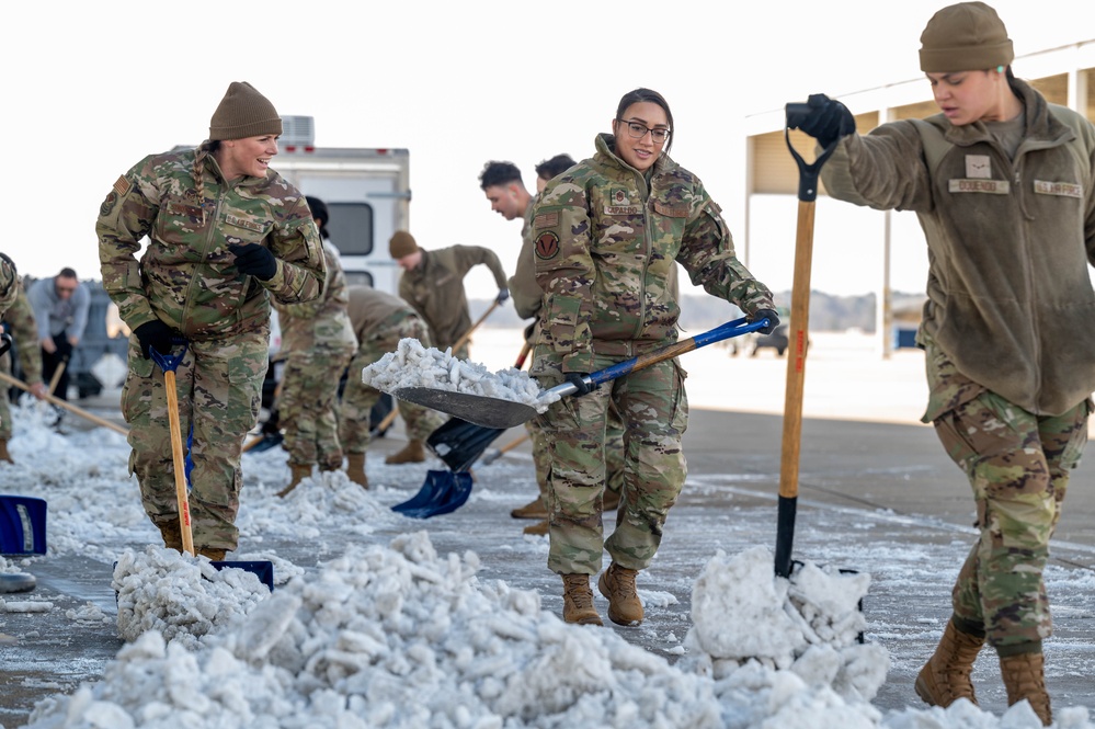 Breaking the Ice: Airmen remove snow, resume flying ops