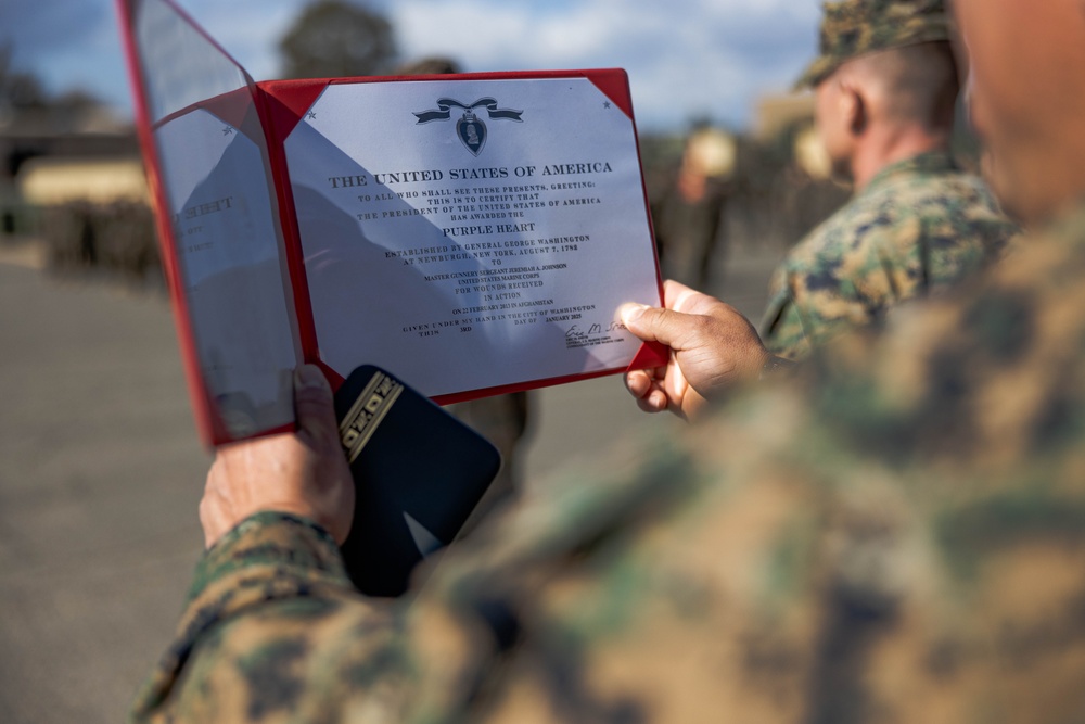 Master Gunnery Sergeant Johnson is presented the Purple Heart