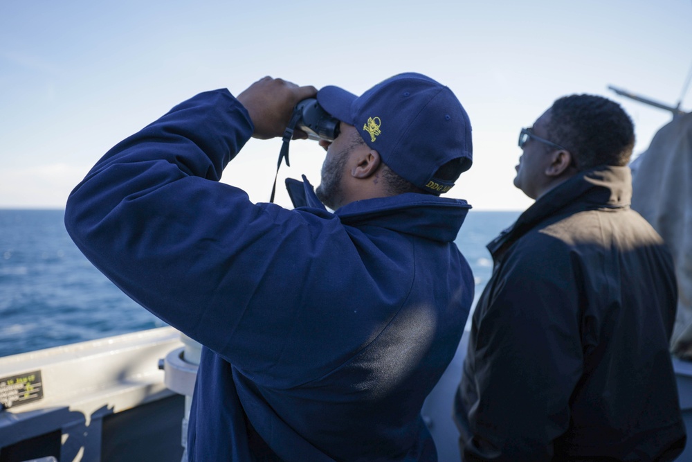 Officers scan the horizon