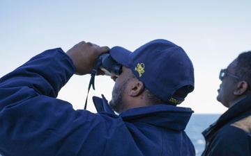 Officers scan the horizon