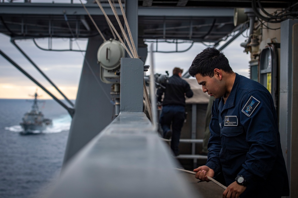 Nimitz Sailor Secures Signal Flags