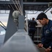 Nimitz Sailor Secures Signal Flags