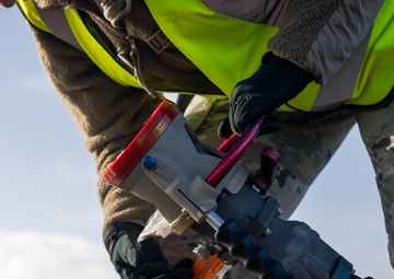 F-35 crew chiefs complete their first F-15E hot pit refuel