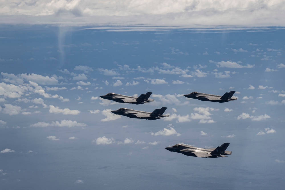 U.S., JASDF and RAAF aircraft fly in formation during CN25