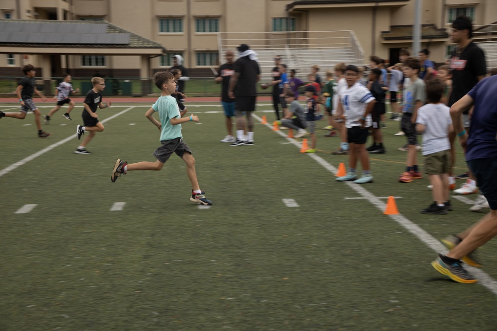 Legends and Heroes Unite: National Football League Hall of Famers and Cheerleaders join forces with Marines at MCBH