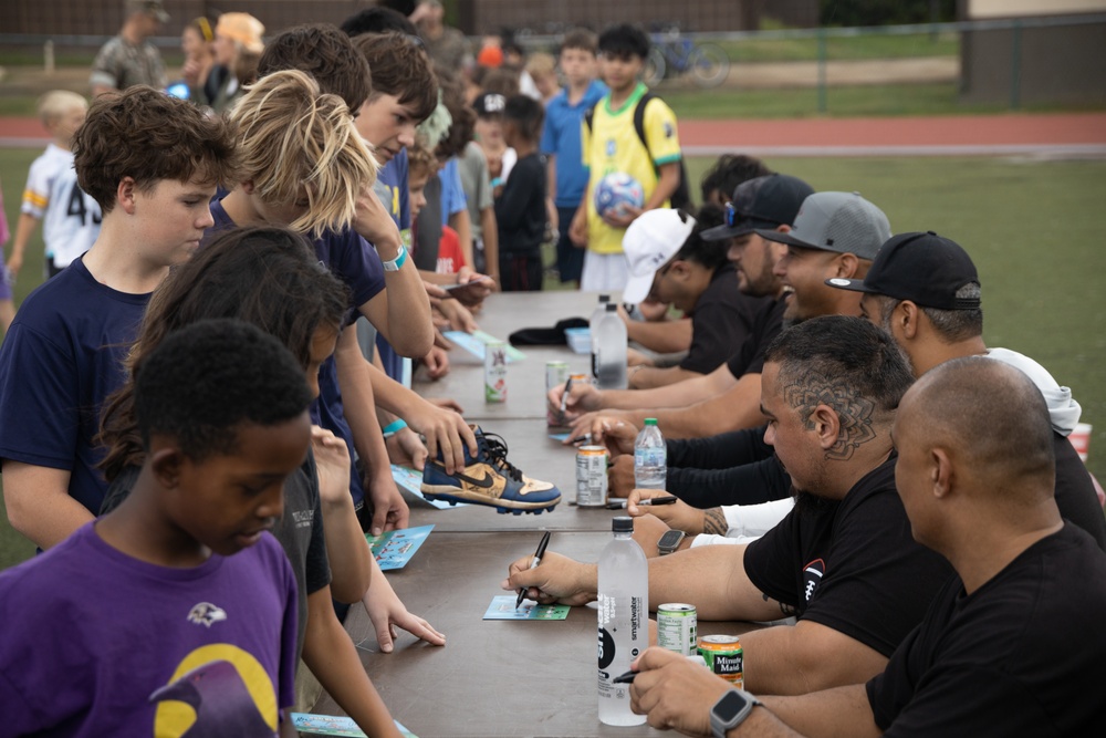 Legends and Heroes Unite: National Football League Hall of Famers and Cheerleaders join forces with Marines at MCBH