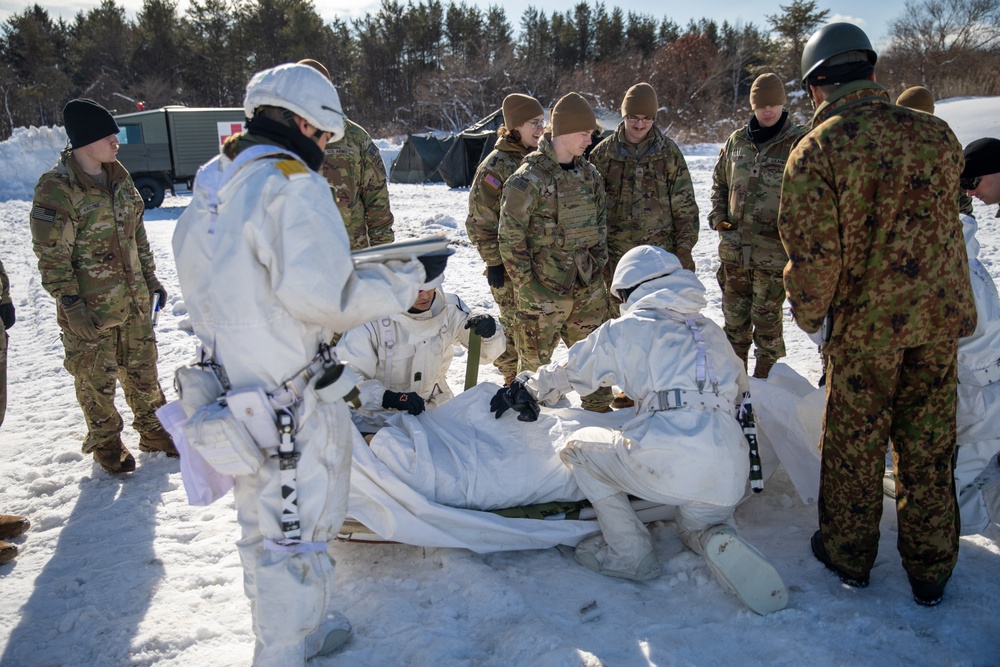 JGSDF members demonstrate how to load an injured patient on a Ahkio Medical Sled