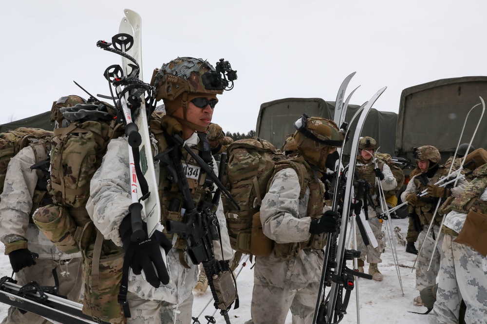 U.S. Army Soldiers Prepare for DownHill Ski Maneuvering