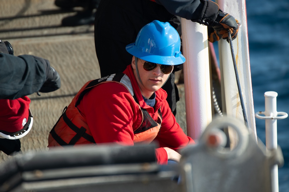USCGC Polar Star (WAGB 10) conducts cutter boat and dive operations in Winter Quarters Bay during Operation Deep Freeze
