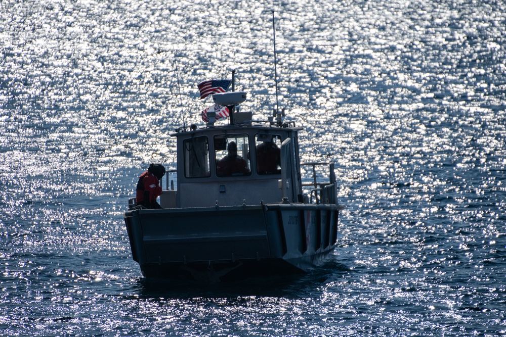USCGC Polar Star (WAGB 10) conducts cutter boat and dive operations in Winter Quarters Bay during Operation Deep Freeze