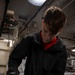 Nimitz Sailor Disassembles Bomb Rack Component