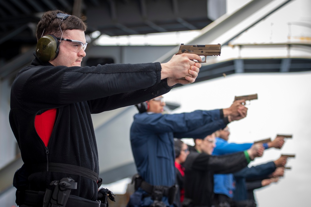 Nimitz Sailors Participate in a Small Arms Gun Shoot