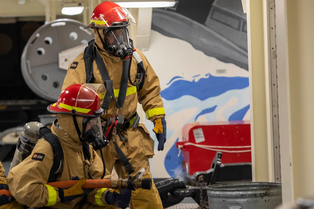 USS Tripoli Sailors Practice 8010 Fire Drill