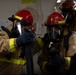 USS Tripoli Sailors Practice 8010 Fire Drill