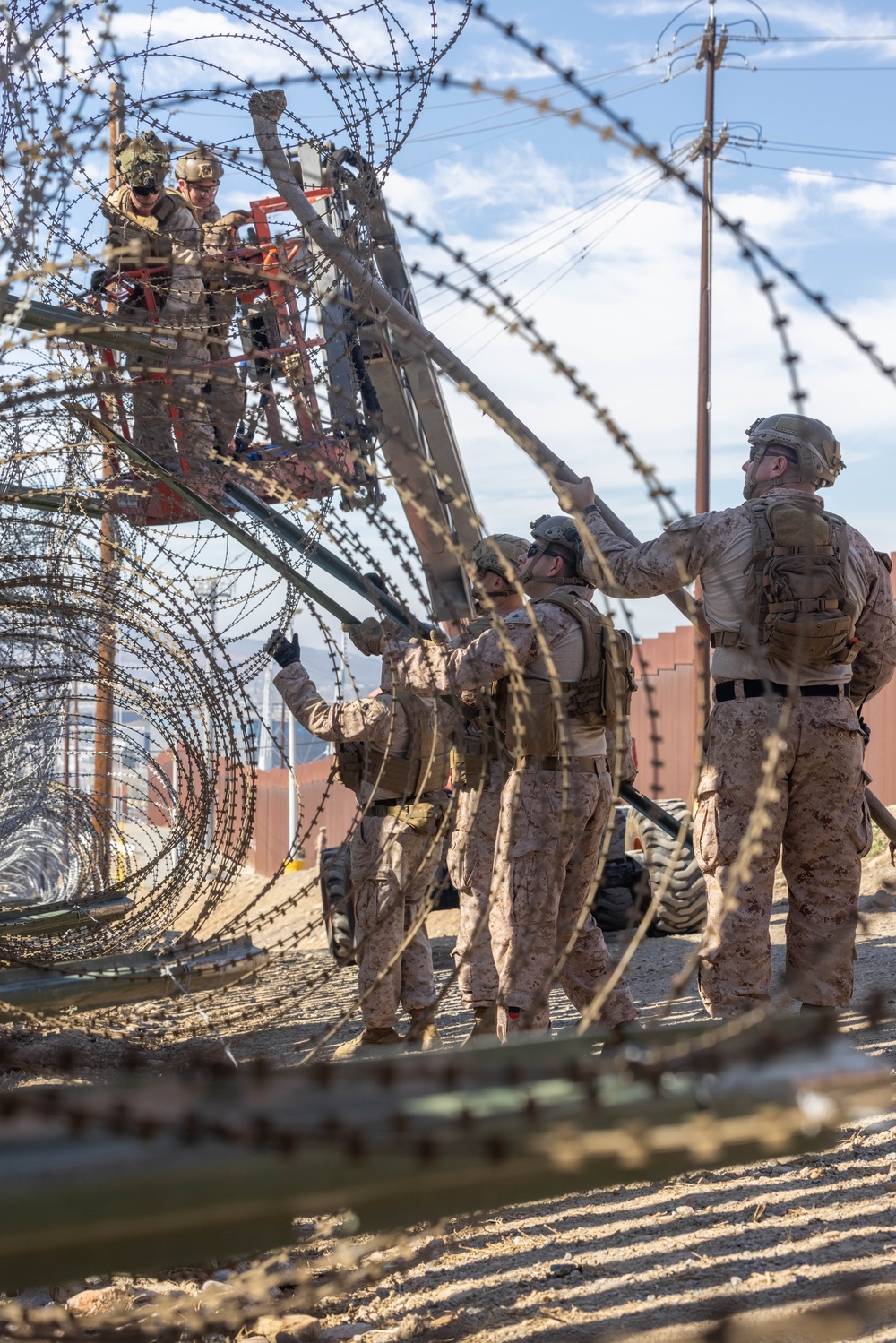 U.S. Marines place concertina wire to assist with border security mission