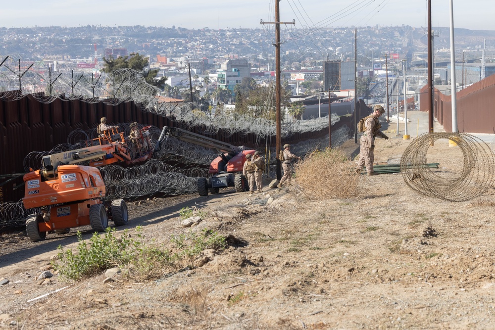 U.S. Marines place concertina wire to assist with border security mission