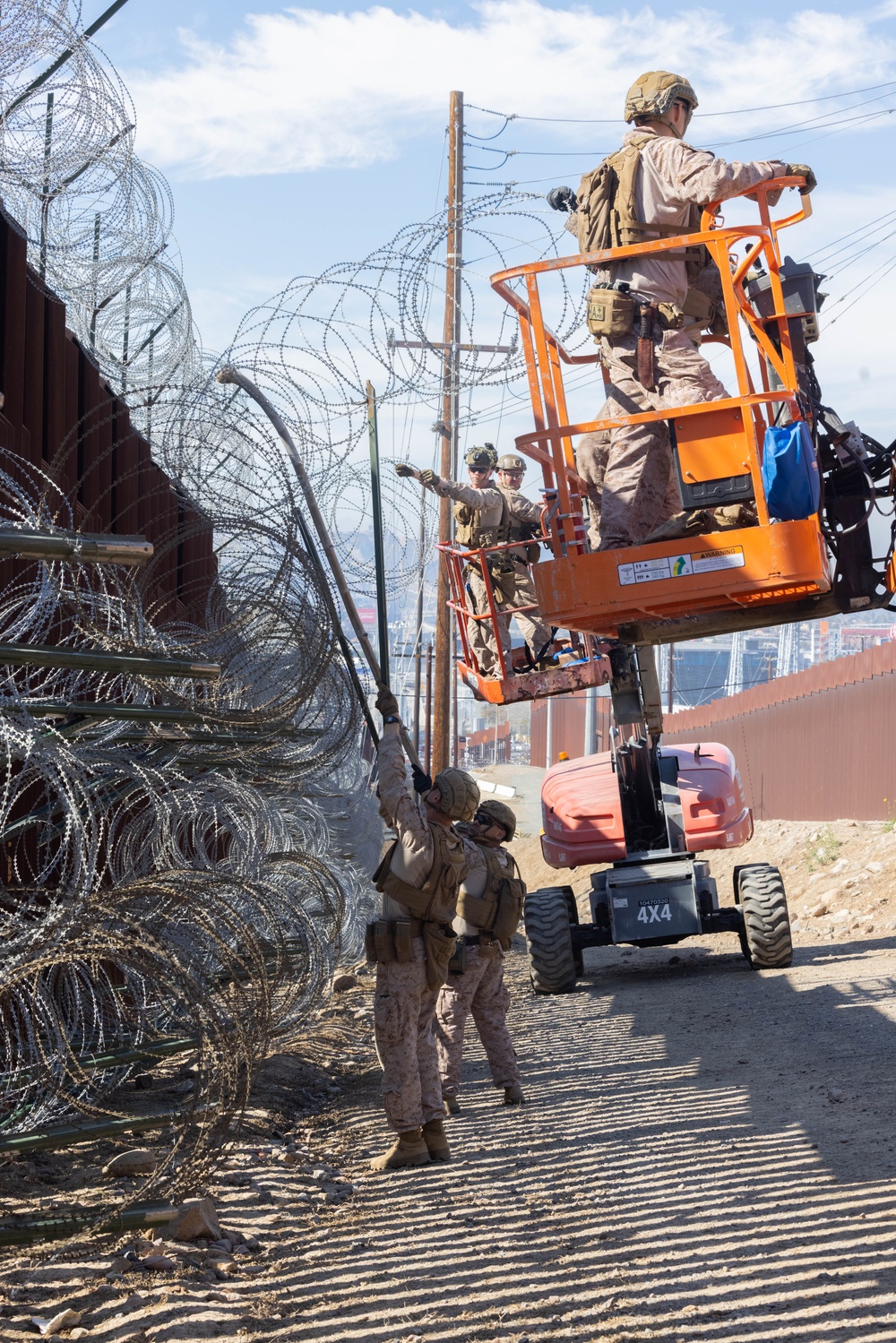 U.S. Marines place concertina wire to assist with border security mission