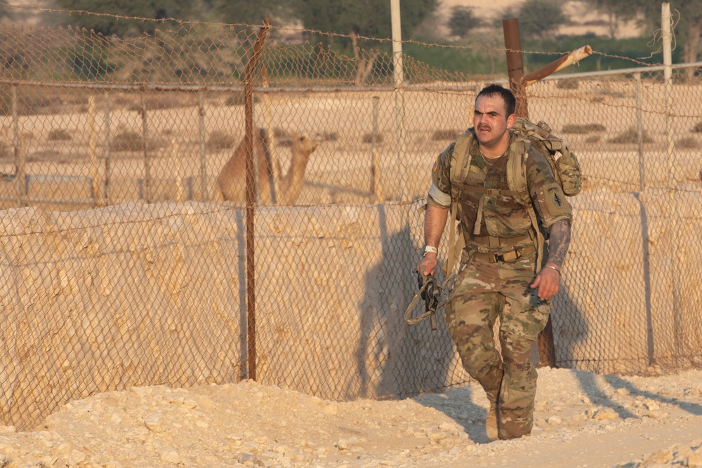 Best Warrior competitors complete a 15km ruck march