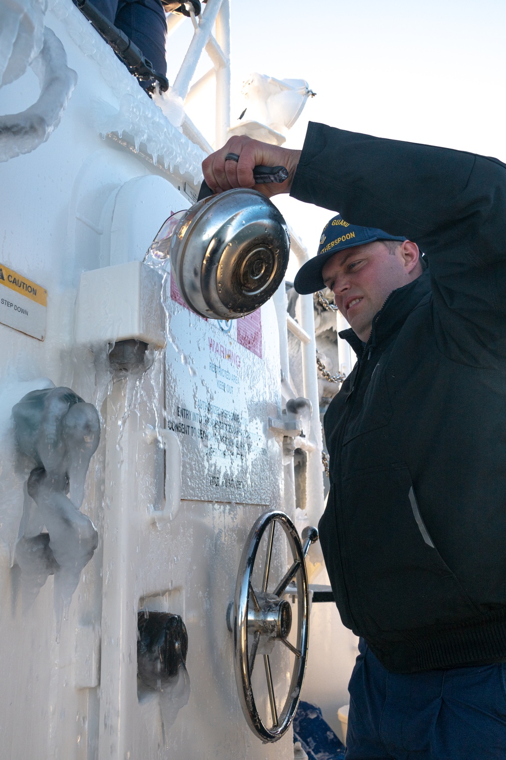 John Witherspoon crew deices their cutter before arrival to homeport in Kodiak, Alaska