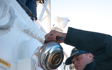 John Witherspoon crew deices their cutter before arrival to homeport in Kodiak, Alaska