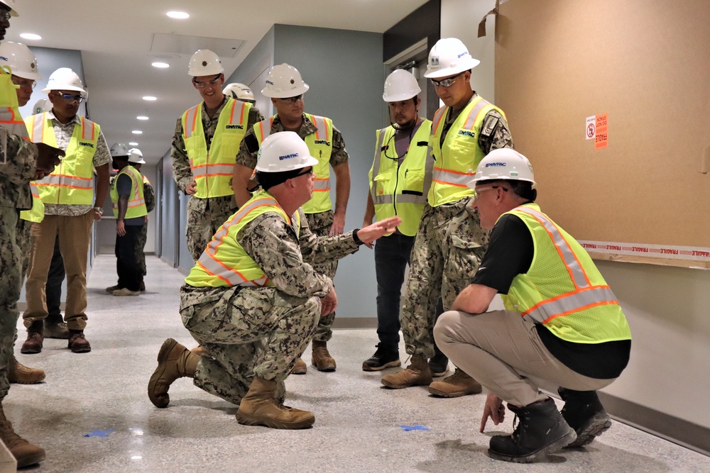 Capt. Blake Burket Discusses Quality Control with OICC Staff During a Site Walk