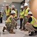 Capt. Blake Burket Discusses Quality Control with OICC Staff During a Site Walk