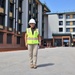 The Construction Manager for Bachelor Officer Quarters Poses with the Project