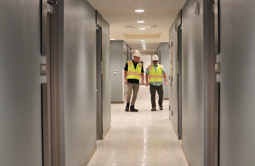 OICC Staff Check the Quality of a Recently Installed Floor in Enlisted Quarters