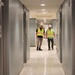 OICC Staff Check the Quality of a Recently Installed Floor in Enlisted Quarters