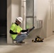 A Contractor Checks Paperwork During HVAC Installation on Marine Corps Base Camp Blaz