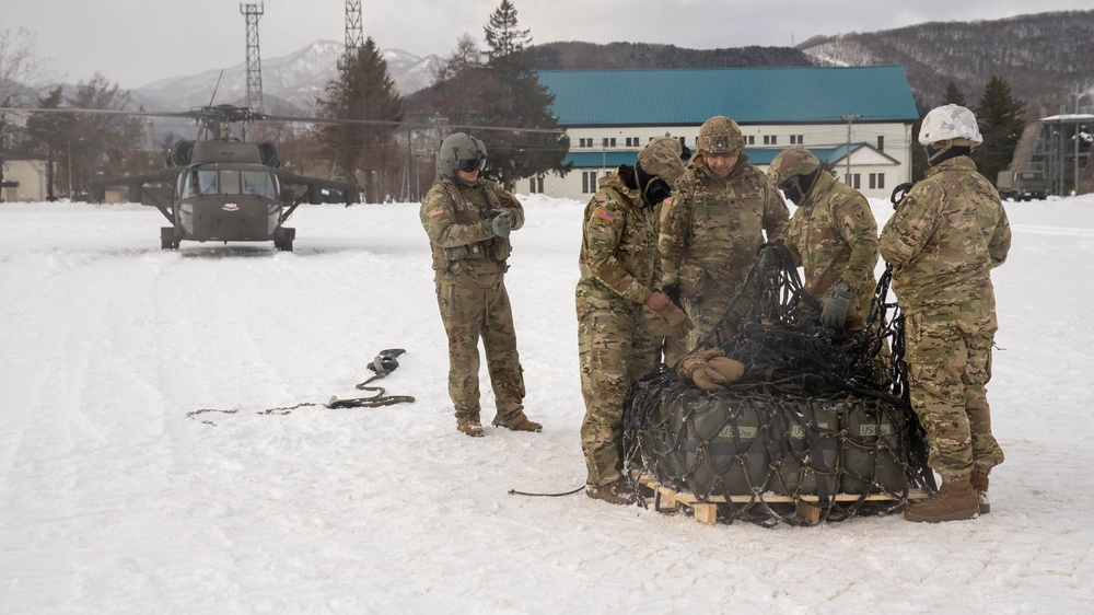 U.S. Army Soldiers Prepare a Cargo Net