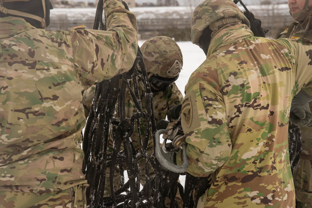 U.S. Army Soldiers Prepare a Cargo Net