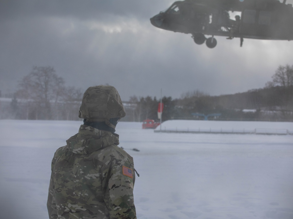 U.S. Army Pfc. Watches a Blackhawk Take Off