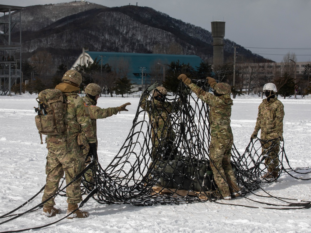 U.S. Army Soldiers Prepare a Cargo Net