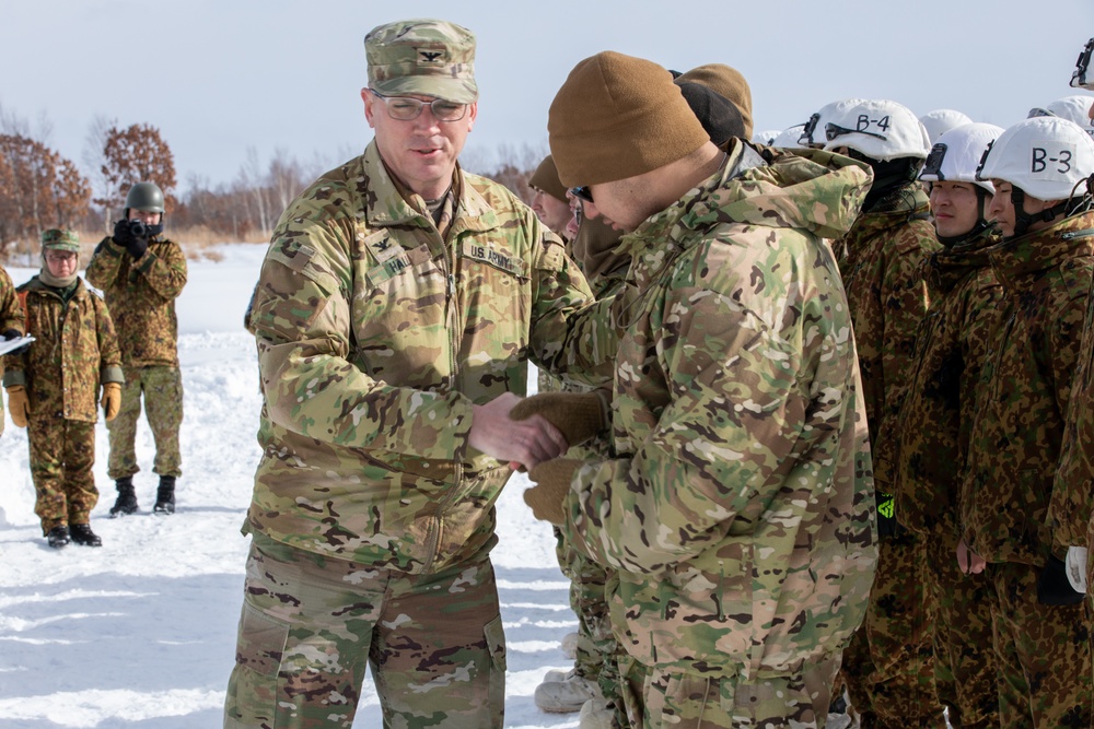 Col. Matthew Hall Presents Pvt. Antonio Jimenez With a Challenge Coin