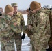 Lt. Col. Ryan Hanrahan and Col. Matthew Hall Present Pvt. Antonio Jimenez With a Challenge Coin