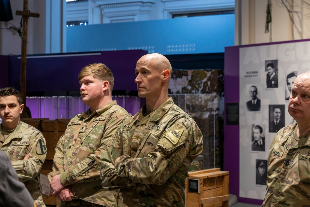 Soldiers observe the Operation Tidal Wave exhibition