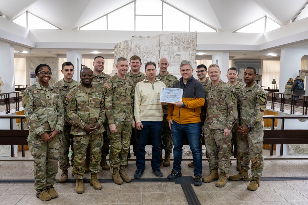 Soldiers present certificate of appreciation to the Romanian National History Museum