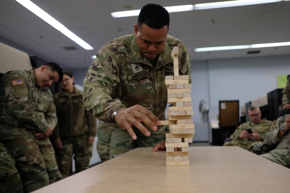 Intense Jenga match during 909 FRSD Battle Assembly