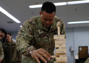 Intense Jenga match during 909 FRSD Battle Assembly