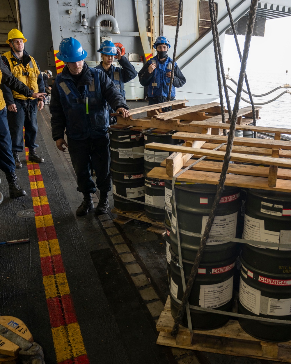 Nimitz Sailors Inspect Cargo During Resupply At Sea